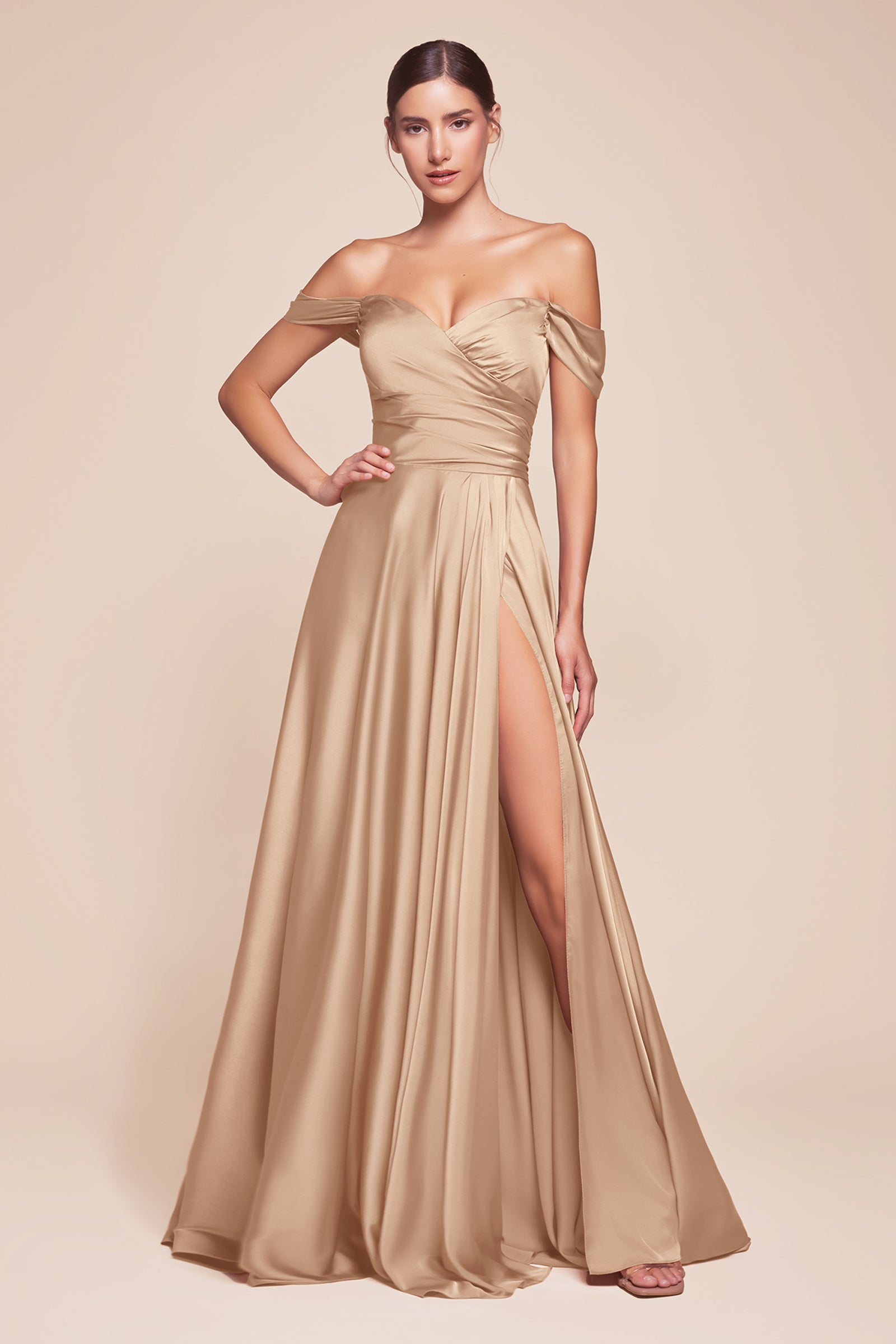 A simple sweetheart neckline gathers around the waistline, flowing into a light slitted skirt