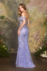 Woman in a purple evening gown standing against a scenic background with flowers and trees.