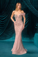 Woman in a strapless, beaded evening gown against a teal curtain backdrop