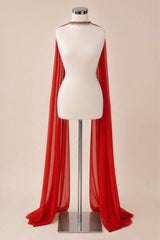A bright red sheer draped cape or shawl displayed on a white mannequin torso with a silver stand against a plain beige studio background.