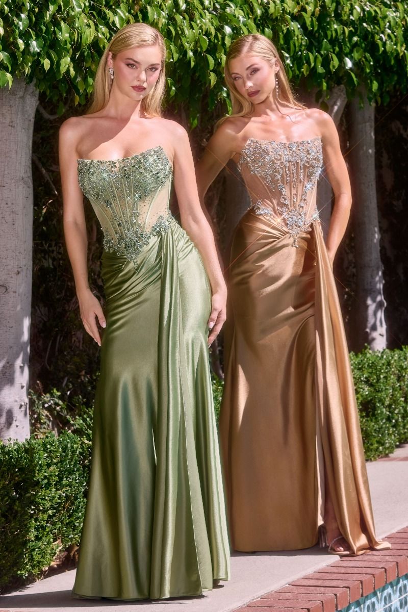 sculpted gown designed for glamour and confidence. Featuring a strapless corset bodice with illusion mesh paneling and intricate bead embellishments