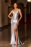 Model wearing a fitted evening gown with thin straps, plunging neckline, lace-up open back, and high side slit, detailed with shimmering embellishments and floor-length train