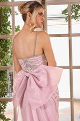 gown features a sleek fitted silhouette adorned with radiant beadwork arranged in sculptural, cascading lines