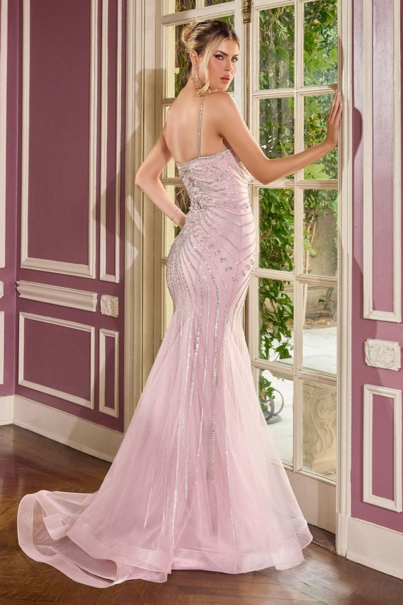 gown features a sleek fitted silhouette adorned with radiant beadwork arranged in sculptural, cascading lines