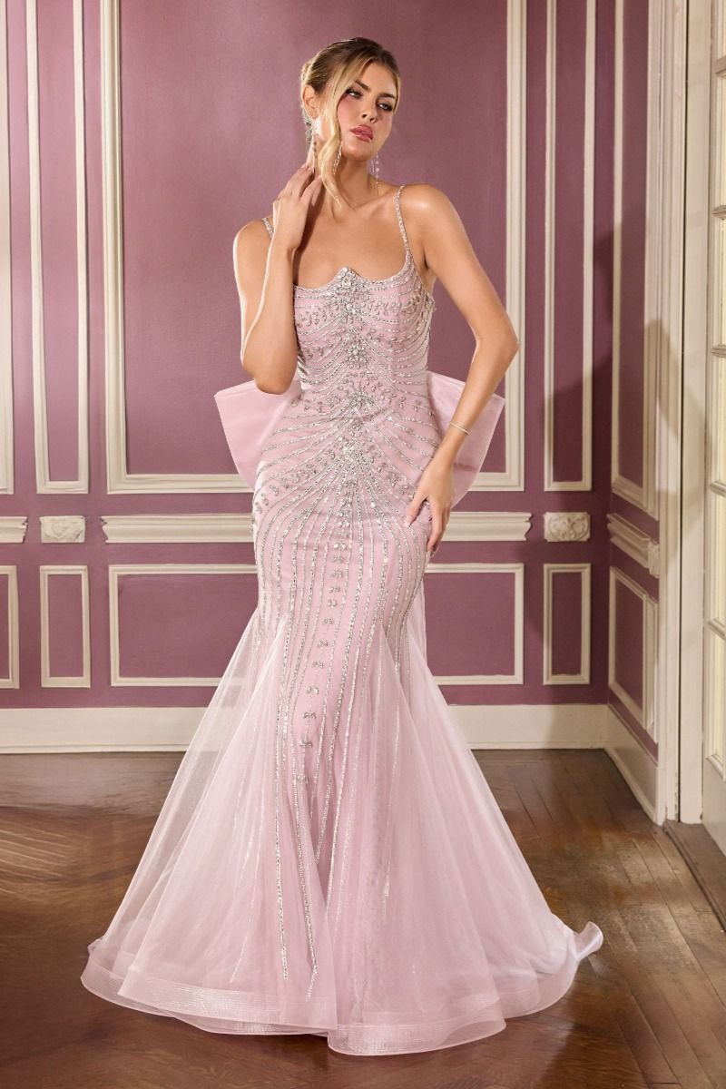 gown features a sleek fitted silhouette adorned with radiant beadwork arranged in sculptural, cascading lines