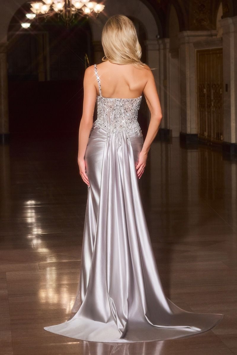 fitted gown designed with a sculpted illusion bodice adorned in intricate beadwork and shimmering crystal accents