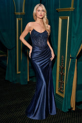 fitted gown showcases a strapless scoop neckline and a dazzling beaded bodice, perfectly paired with a satin glitter skirt for added sparkle