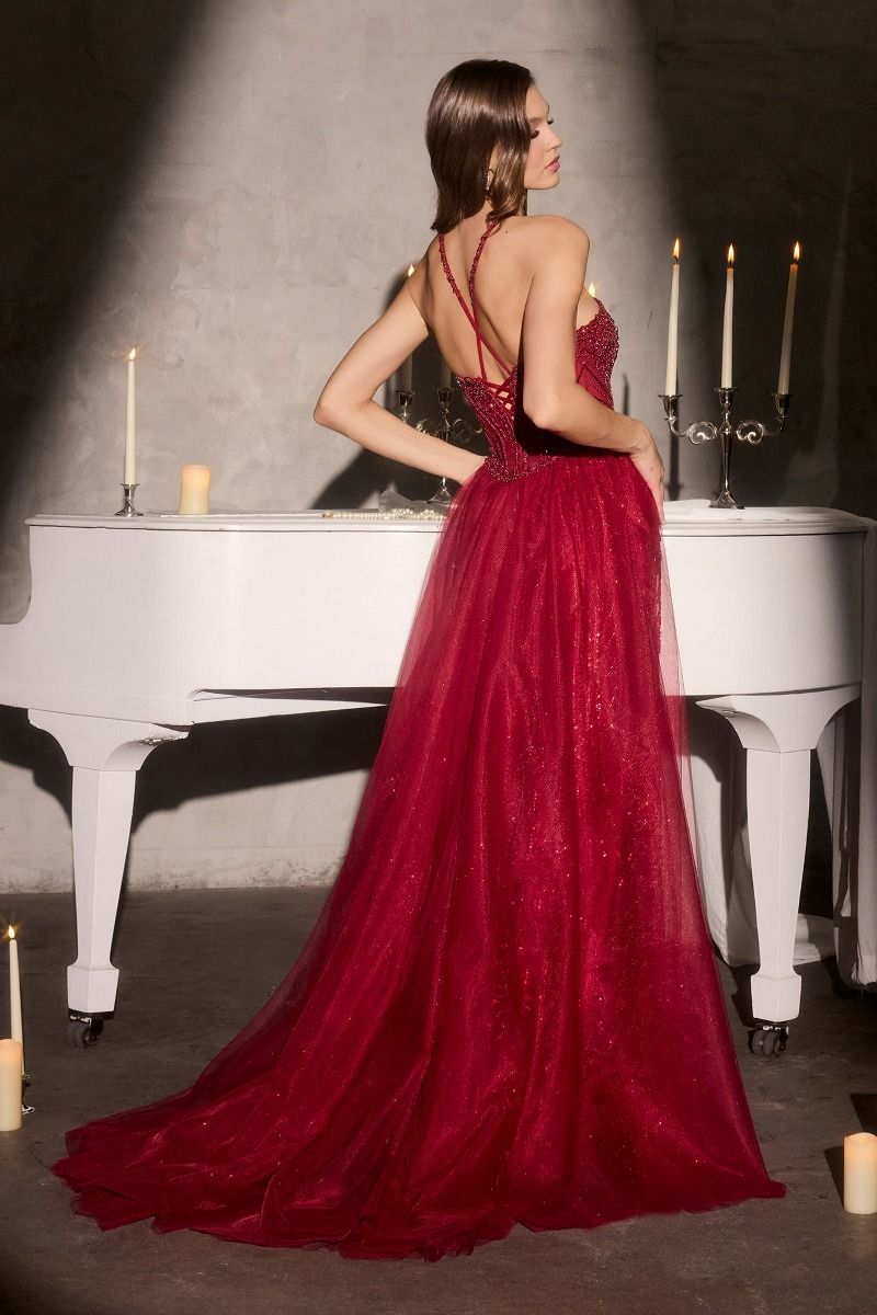 fitted gown features a striking halter neckline with an embellished crossover design