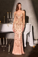 Woman in a strapless, embellished evening gown standing in front of a piano with candles.