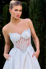 strapless sweetheart bodice features pleated cups, corset-style boning, and intricate beaded embellishments over sheer illusion mesh