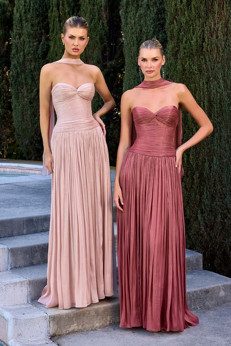 gown features a strapless sweetheart neckline and a finely ruched bodice crafted from pleated luminescent chiffon