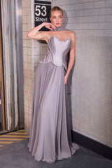sculpted satin corset bodice, it features delicate crystal embellishments that trace along the neckline and waist