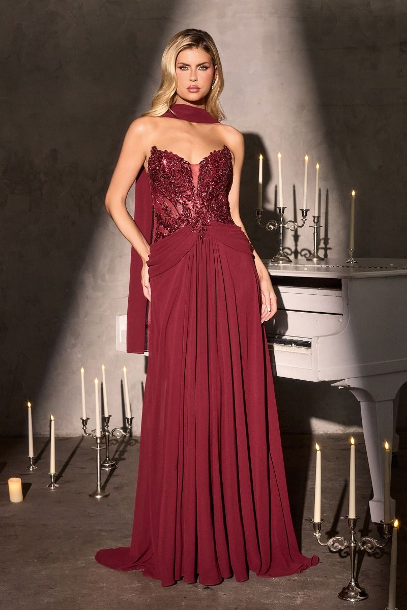 gown features a sweetheart illusion neckline paired with a shimmering, intricately beaded bodice