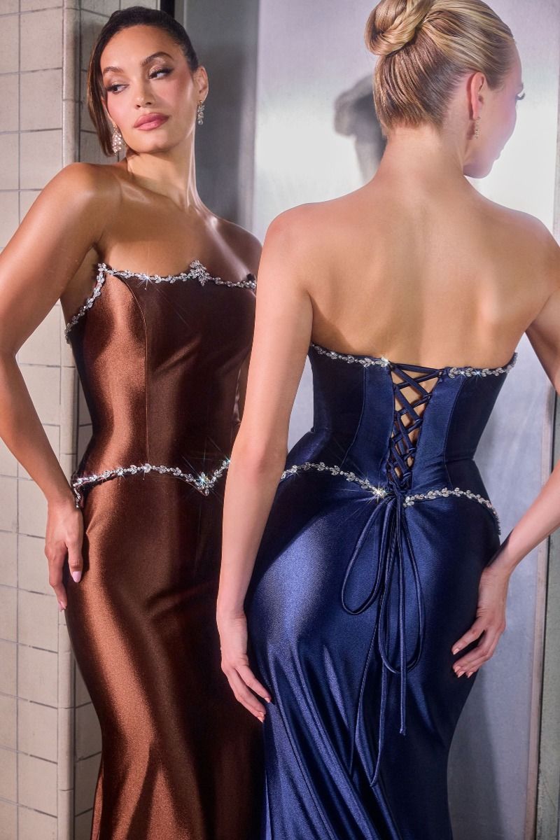satin fitted gown stuns with its clean strapless neckline and subtle crystal embellishments tracing the bodice and waistline