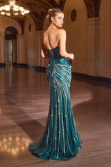 Model wearing a strapless fitted gown with structured corset bodice, ornate beaded detailing, and floor-length mermaid skirt
