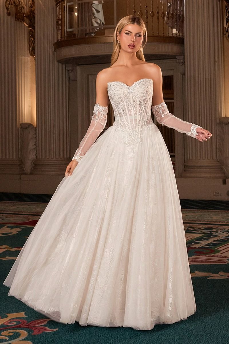 A-line gown features a strapless corset bodice adorned with intricate lace appliqué and shimmering hand beading