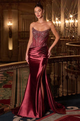 fitted gown features a strapless scoop neckline and a corset bodice adorned with crystal lace embellishments