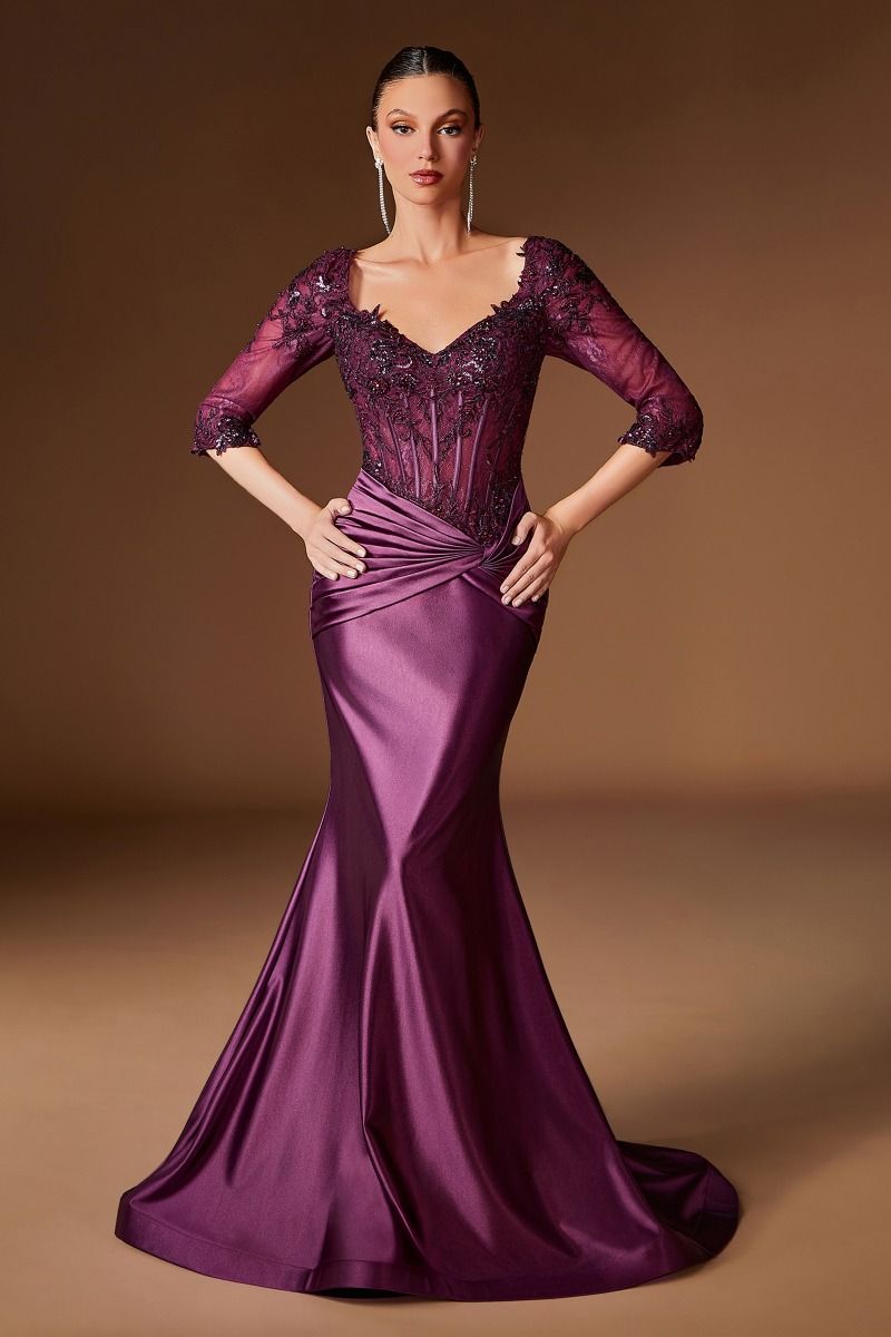 Woman wearing a purple evening gown with a brown background