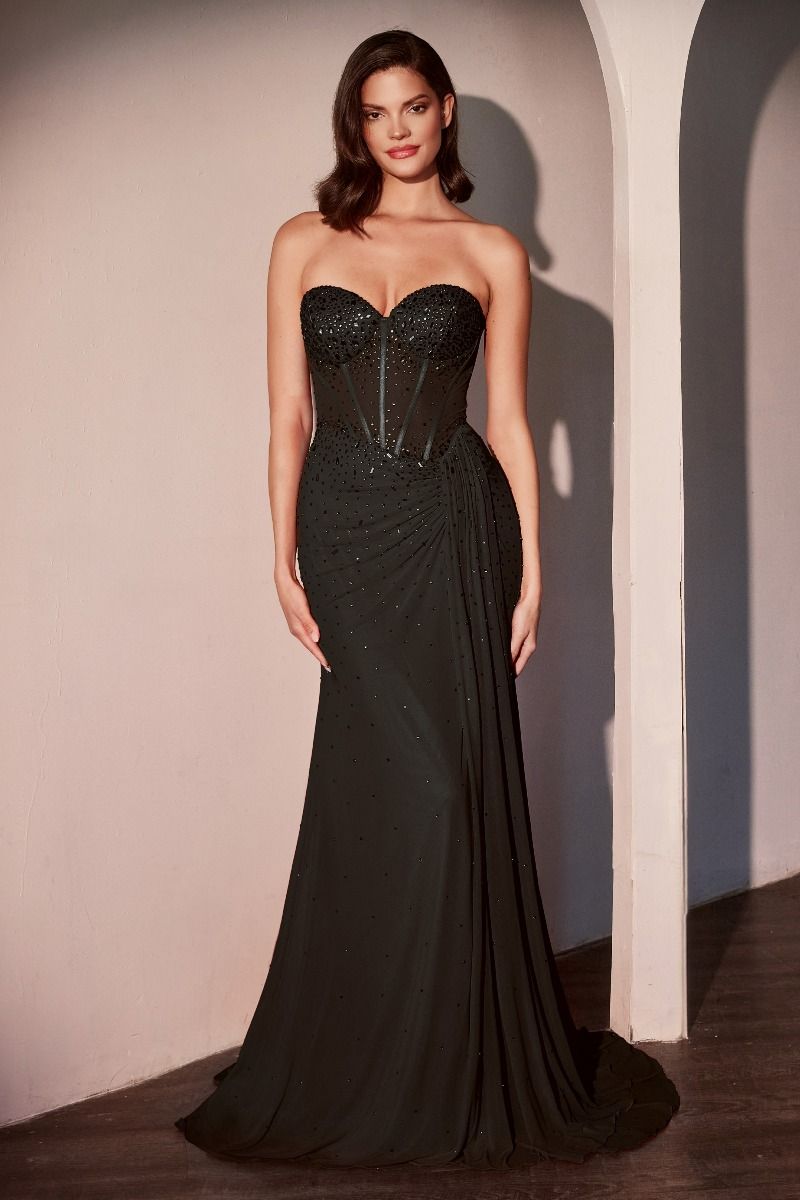 fitted strapless gown showcases a sweetheart neckline and a sheer bodice adorned with scattered rhinestone details