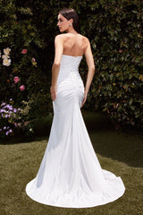 fitted dress features a strapless pointed V-neckline, gathered waistline, and a chic leg slit