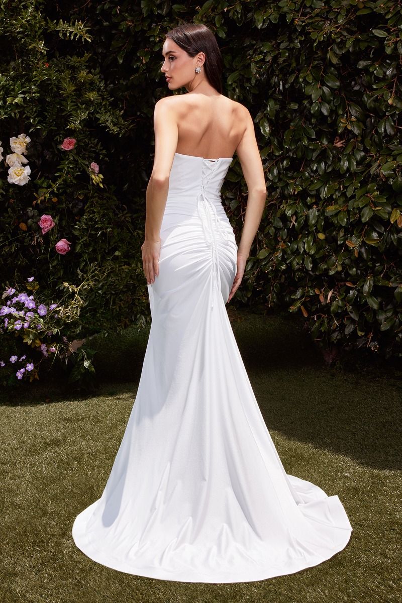 fitted dress features a strapless pointed V-neckline, gathered waistline, and a chic leg slit