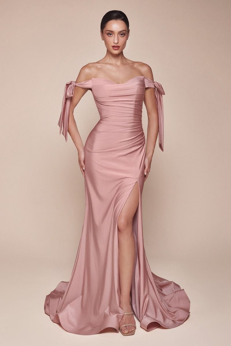 alluring off-the-shoulder neckline framed by elongated ties and a floor- pooling fishtail hem defined by a dramatic front slit 