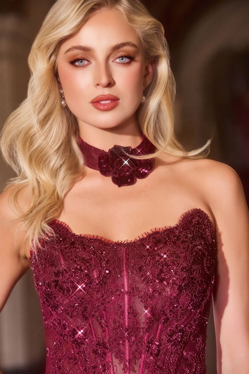 fitted gown with a strapless neckline, corset-style bodice, and sequin detailing.