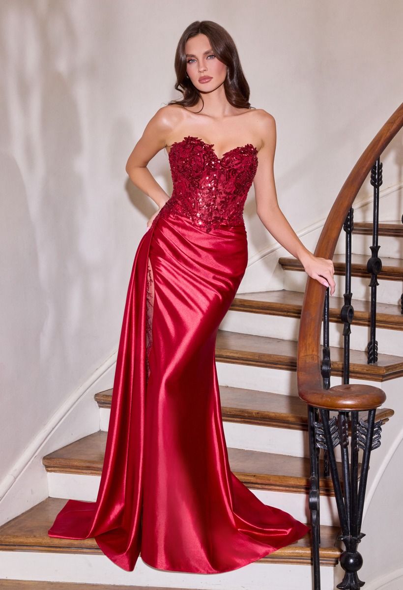 itted gown showcases a dramatic sweetheart neckline and a richly beaded bodice
