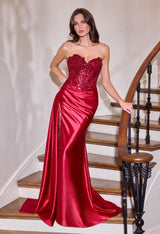 itted gown showcases a dramatic sweetheart neckline and a richly beaded bodice