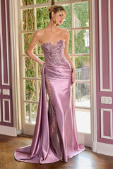 itted gown showcases a dramatic sweetheart neckline and a richly beaded bodice