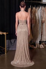 Champagne metallic pleated halter gown with a plunging neckline, draped bodice, lace-up corset back, and floor-length skirt.