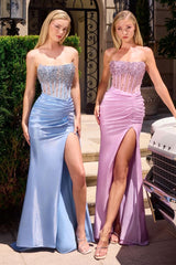 Model wearing a strapless gown featuring a beaded corset bodice, ruched waist detailing, and high side slit