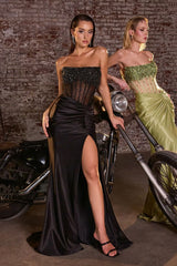 Model wearing a strapless gown featuring a beaded corset bodice, ruched waist detailing, and high side slit