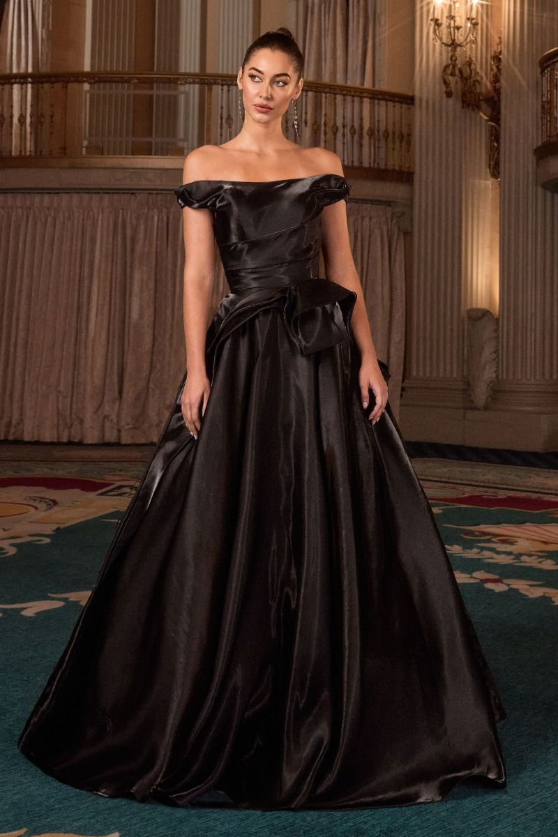 ball gown features an off-the-shoulder neckline and a pleated waistline