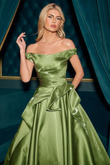 ball gown features an off-the-shoulder neckline and a pleated waistline