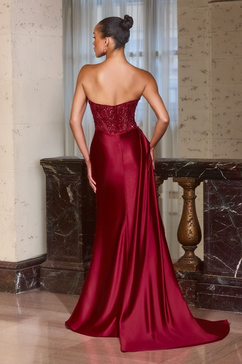 evening gown with a thigh-high slit and dramatic draped side sash