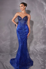 Woman wearing a blue evening gown against a gray background