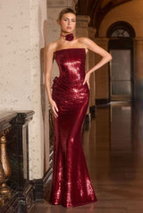 fitted gown stuns with its sleek strapless neckline and gleaming sequin finish