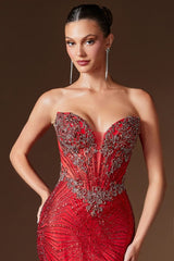 Woman wearing a red beaded evening gown against a brown background