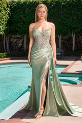 dress features an embellished, corset-style bodice with intricate silver detailing and a softly draped skirt that flows into a long train.