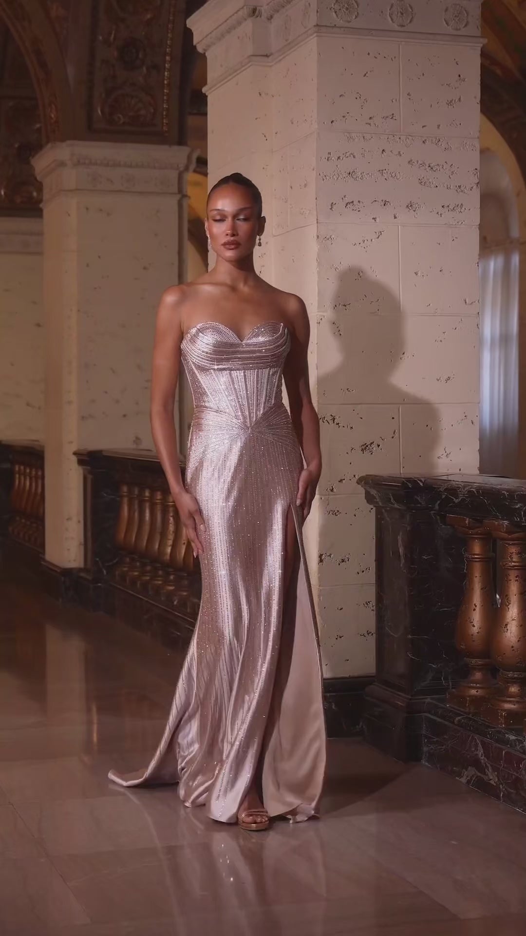 fitted gown, designed with a sculpted sweetheart neckline and a shimmering fully-beaded design