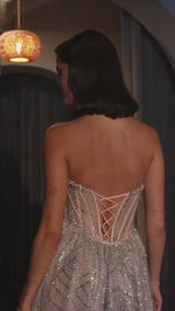fitted strapless dress features a plunging neckline and a structured bodice for excellent support, complemented by a lace-up corset back 