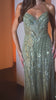fitted gown featuring a chic halter keyhole neckline and a striking racerback design