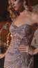 fitted gown captivates with its one-shoulder neckline and intricate beadwork