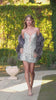fitted short dress, designed with a bold plunging neckline and a strapless silhouette