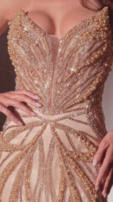 fitted strapless gown features a plunging neckline and an embellished contouring motif that beautifully enhances your silhouette