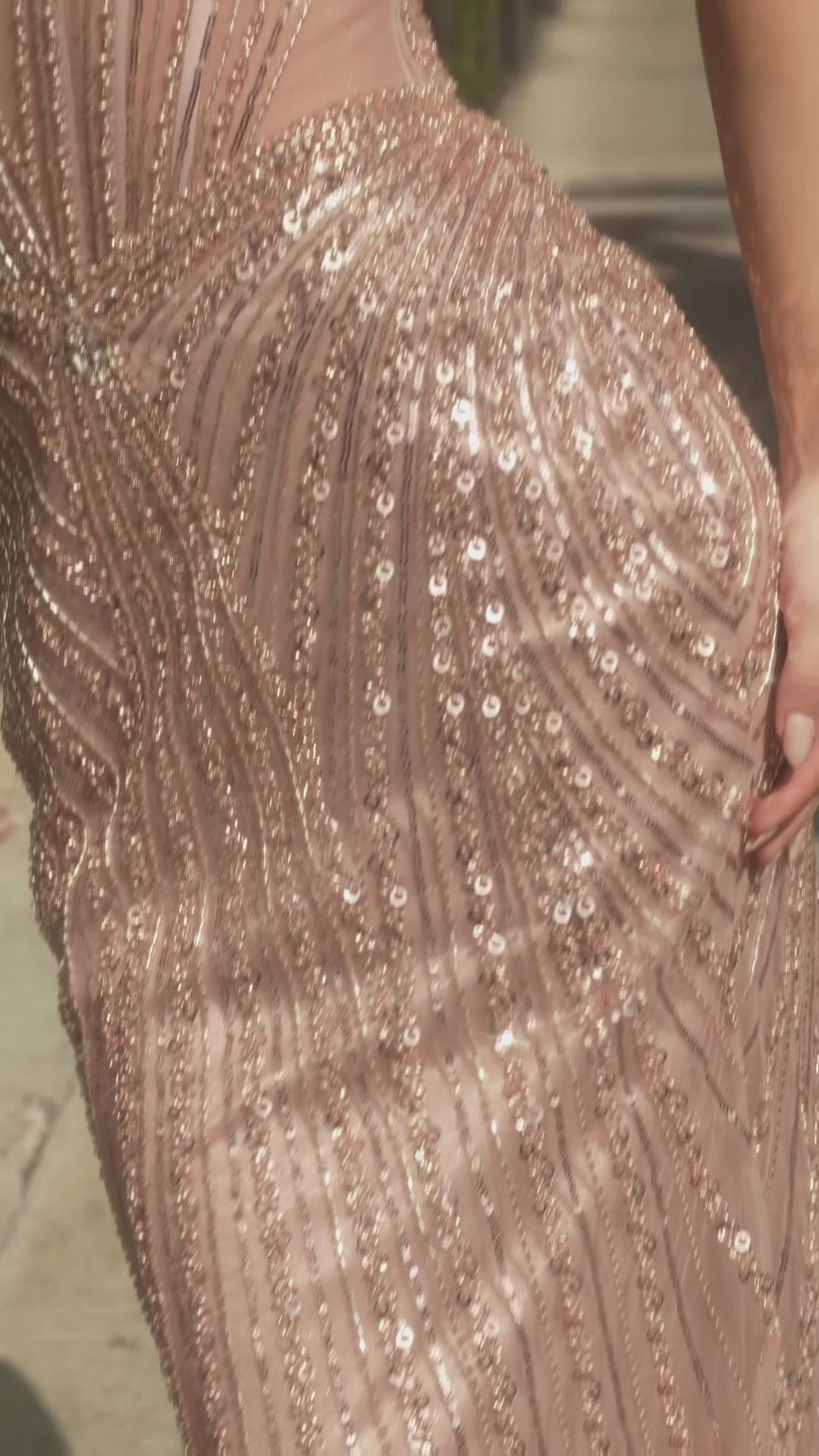 fitted gown featuring a chic halter keyhole neckline and a striking racerback design