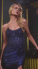 fitted gown showcases a strapless scoop neckline and a dazzling beaded bodice, perfectly paired with a satin glitter skirt for added sparkle