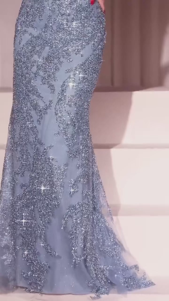 fit and flare silhouette adorned with a decadent layer of tulle over a nude lining