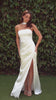 fitted strapless gown, crafted from luxe satin, features a sleek straight neckline, gathered waistline, and elegant leg slit